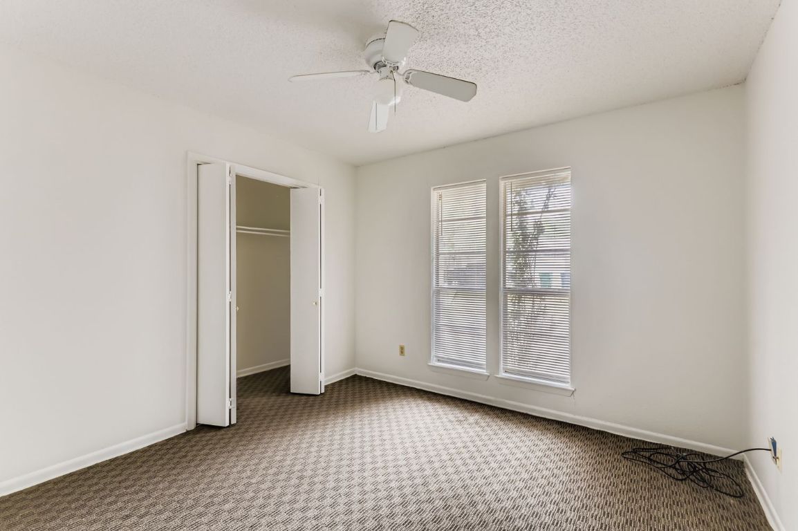 111 Stubblefield Drive Elgin, TX 78621 - Photo 16 of 27 an empty room with windows