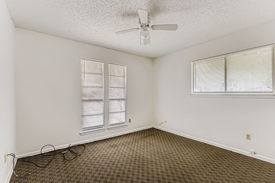 111 Stubblefield Drive Elgin, TX 78621 - Photo 19 of 27 an empty room with windows