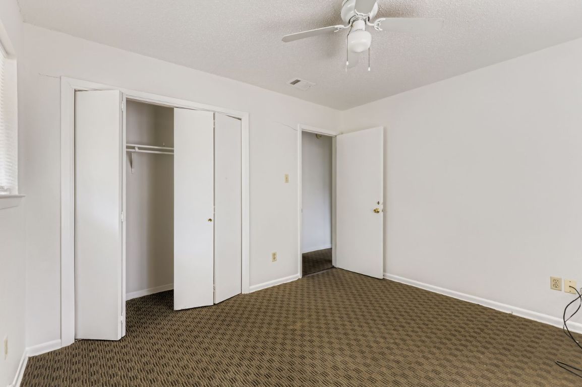 111 Stubblefield Drive Elgin, TX 78621 - Photo 20 of 27 a big room with closet and wooden floor