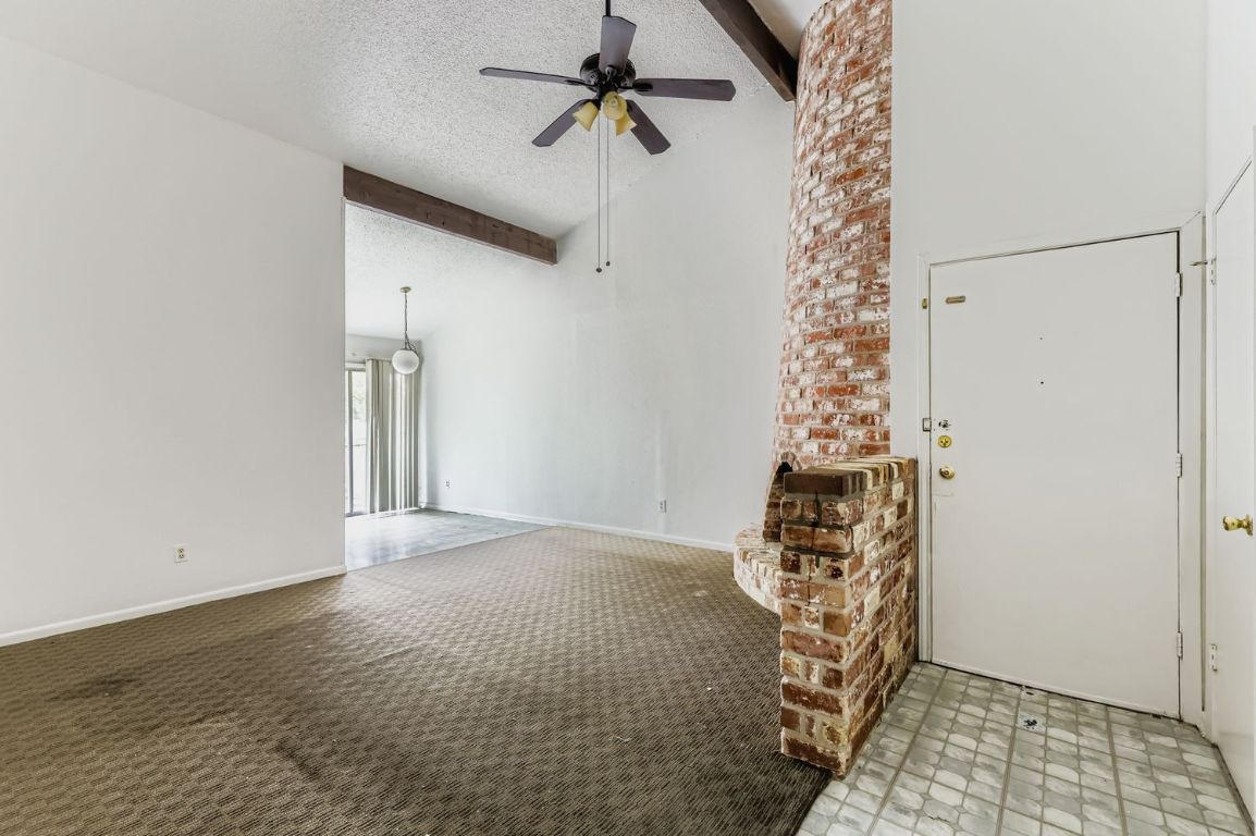 111 Stubblefield Drive Elgin, TX 78621 - Photo 2 of 27 an empty room with windows