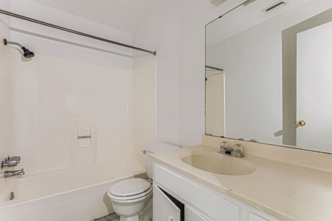 111 Stubblefield Drive Elgin, TX 78621 - Photo 22 of 27 a bathroom with a sink and a toilet
