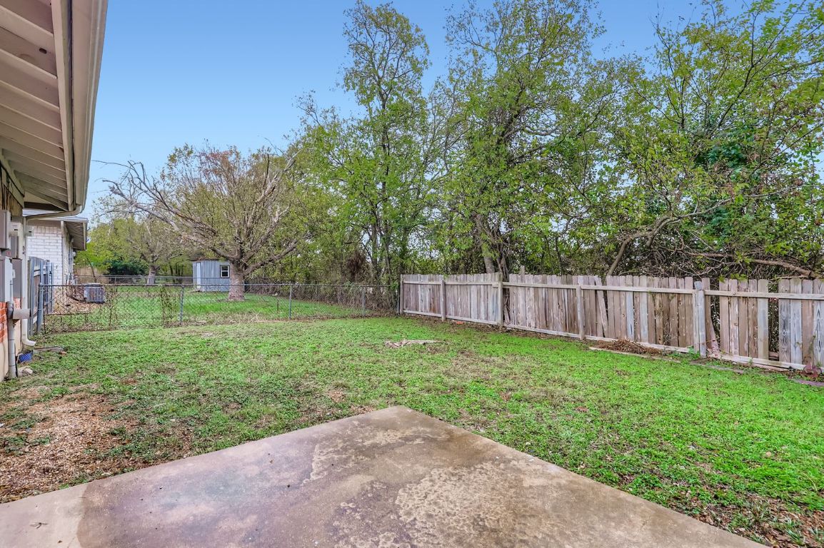 111 Stubblefield Drive Elgin, TX 78621 - Photo 23 of 27 a view of a backyard with a small cabin
