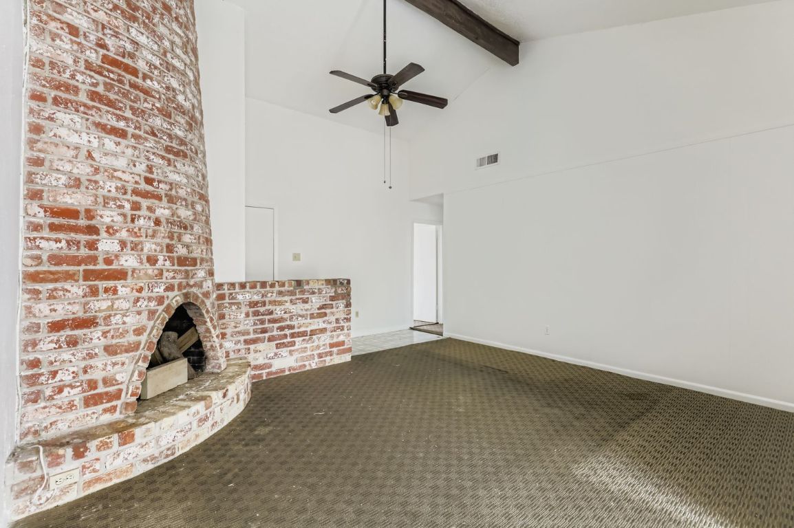 111 Stubblefield Drive Elgin, TX 78621 - Photo 4 of 27 a view of workspace with wooden floor and a ceiling fan