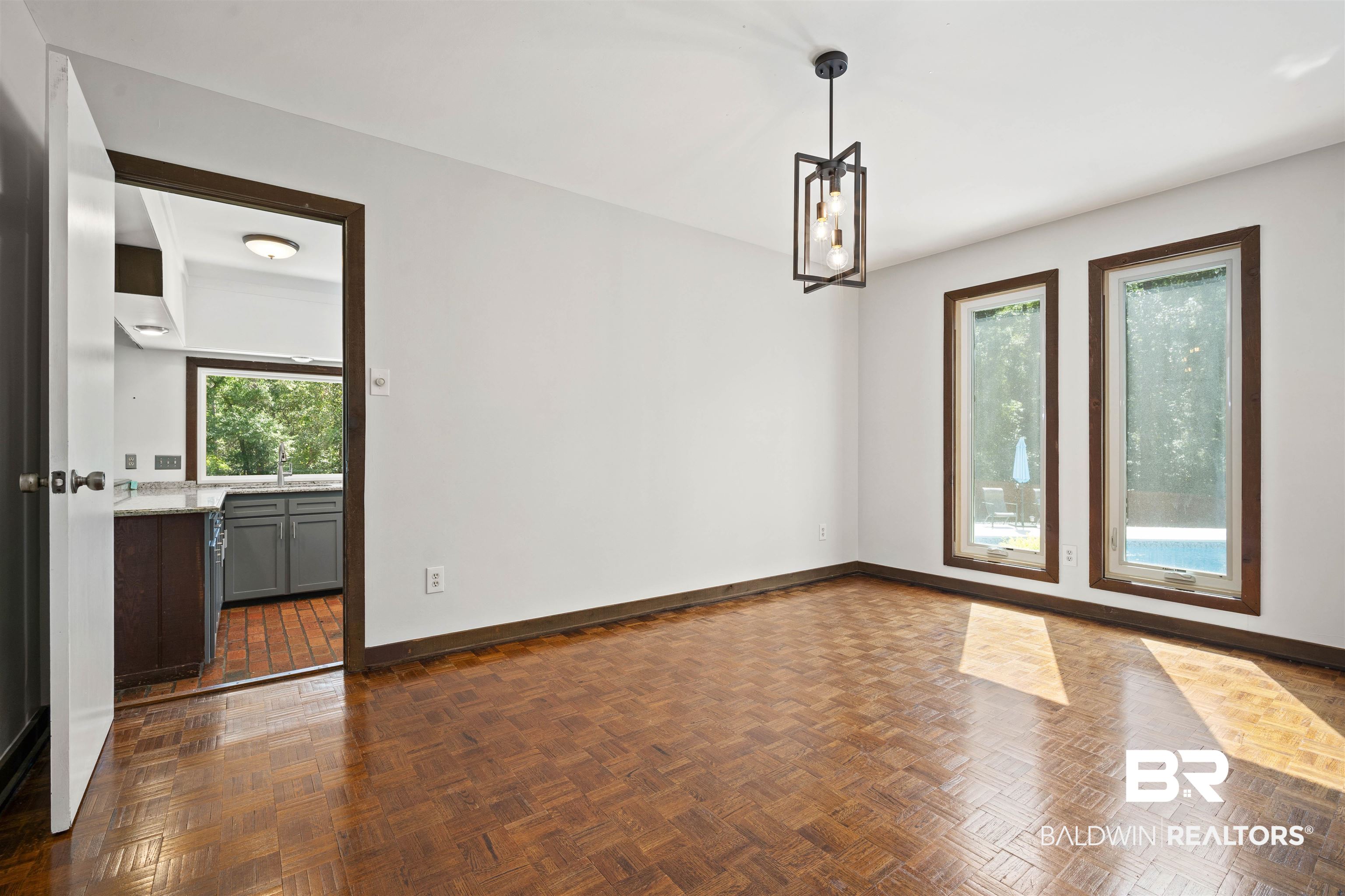 7912 Yorkhaven Road Mobile, AL 36695 - Photo 12 of 41 Spare room with plenty of natural light and a chandelier