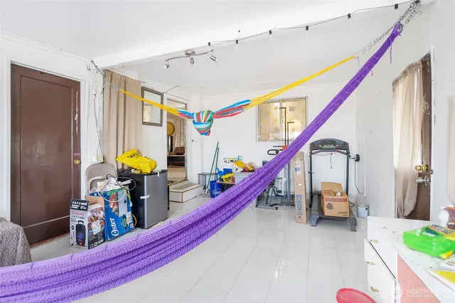 a living room with furniture and stairs