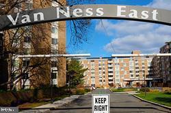 2939 Van Ness Street Northwest, Unit 504 Washington, DC 20008 - Photo 1 of 1 a view of a street with a building in front of it