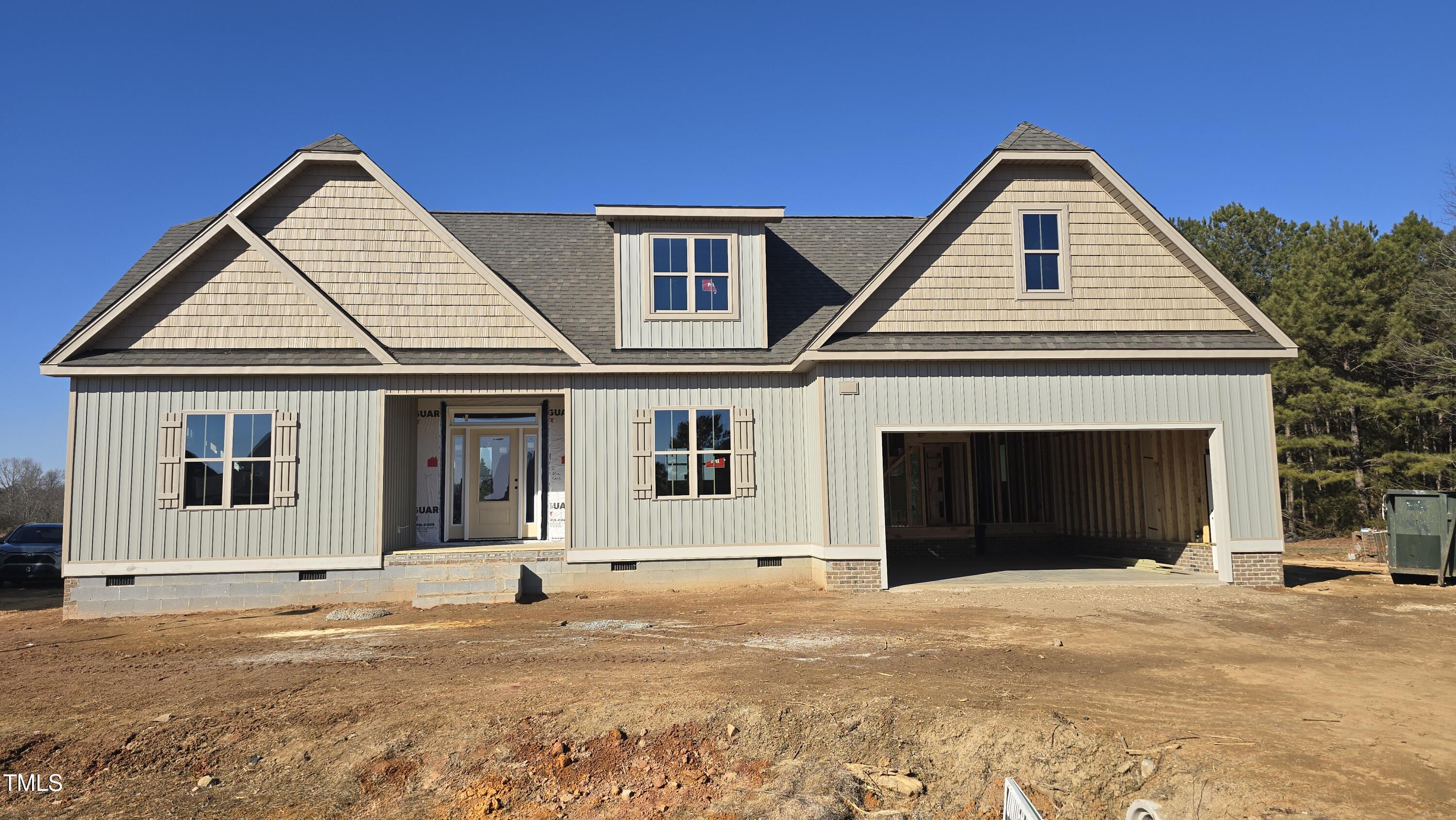129 Lassiter Rdg Dr. Four Oaks, NC 27524 - Photo 1 of 2 a front view of a house with a yard