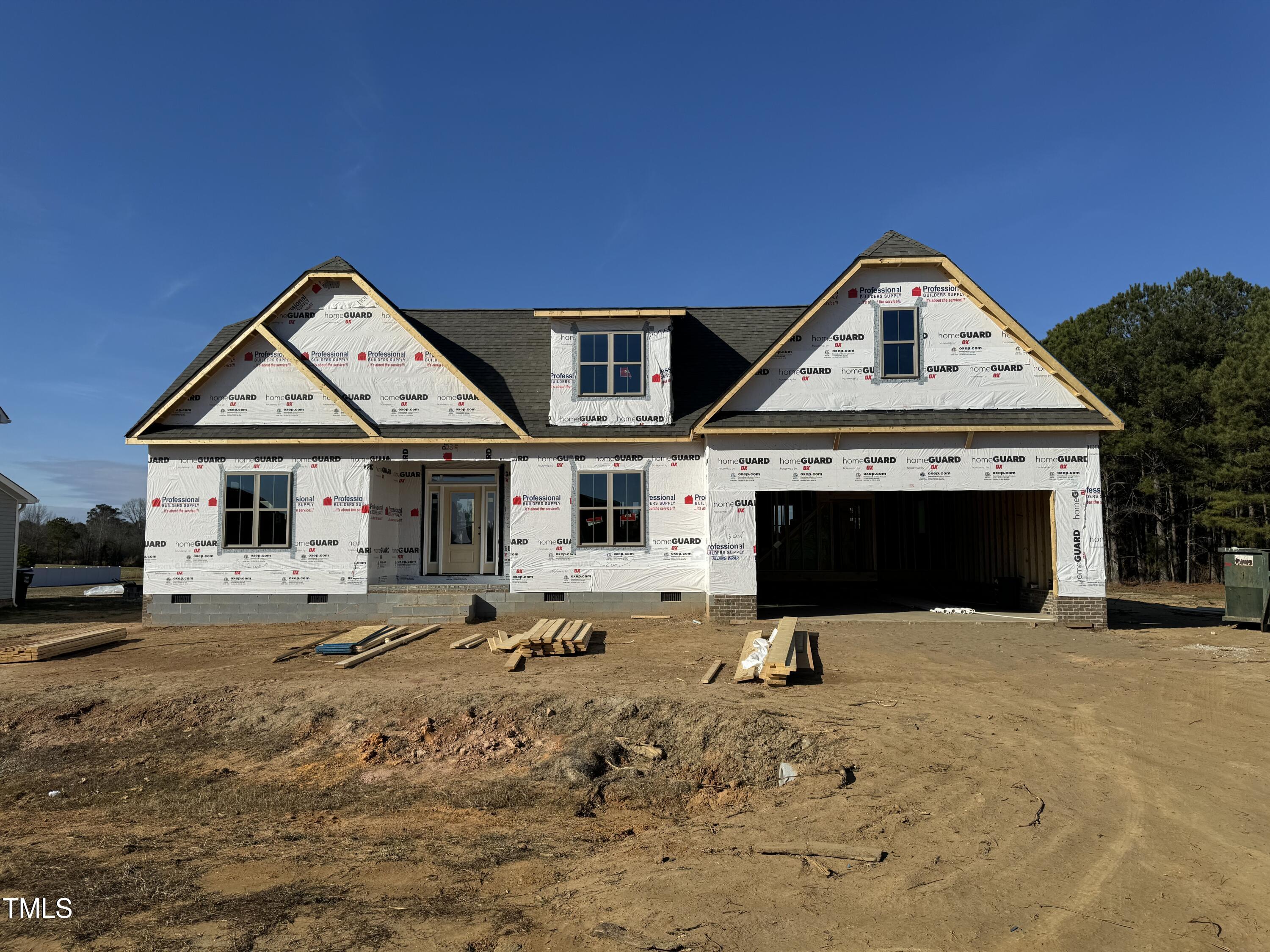 129 Lassiter Rdg Dr. Four Oaks, NC 27524 - Photo 2 of 2 a front view of a house with a yard