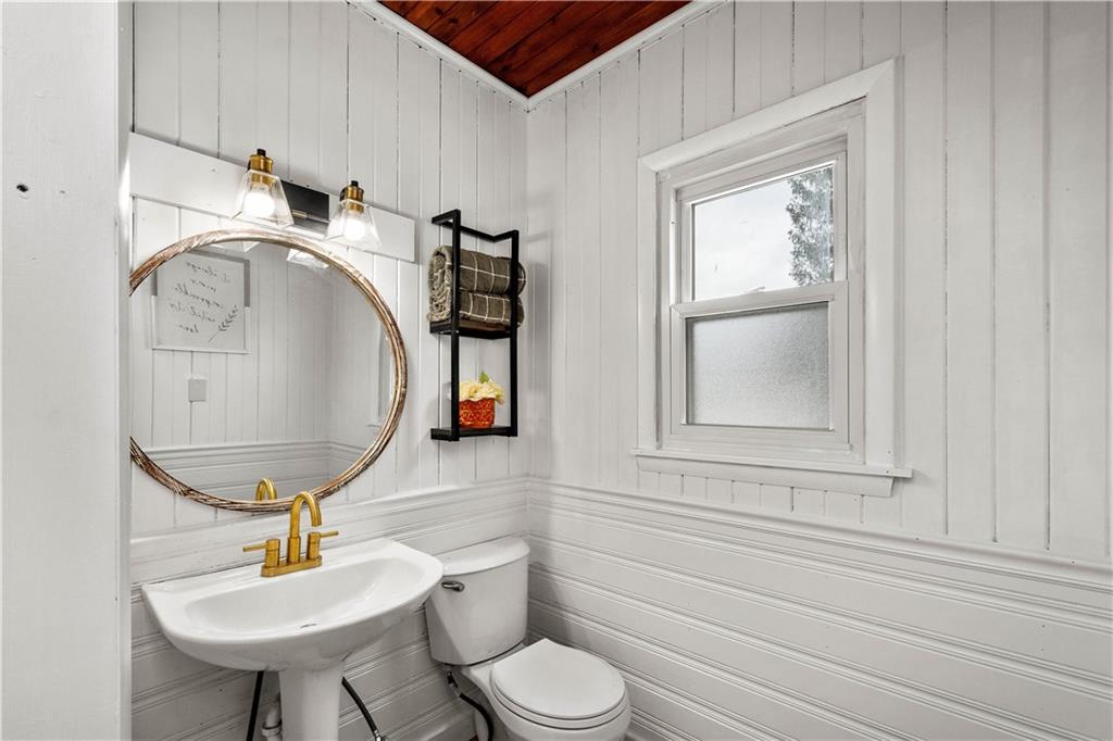 147 Carmichaels Street Rices Landing, PA 15357 - Photo 11 of 36 a bathroom with a toilet a sink and mirror
