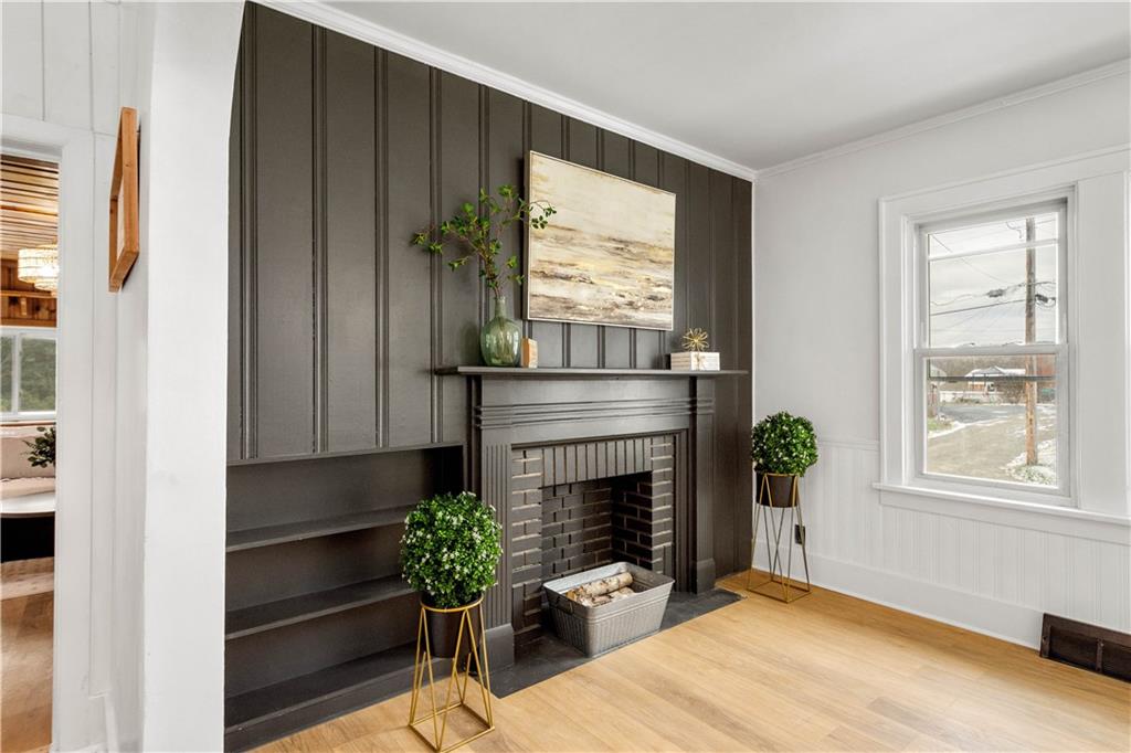 147 Carmichaels Street Rices Landing, PA 15357 - Photo 14 of 36 a living room with furniture and a fireplace