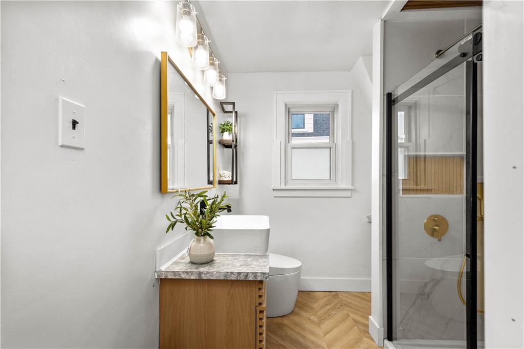 147 Carmichaels Street Rices Landing, PA 15357 - Photo 20 of 36 a bathroom with a granite countertop sink and a mirror