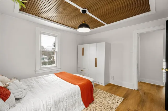 a bedroom with bed and a window