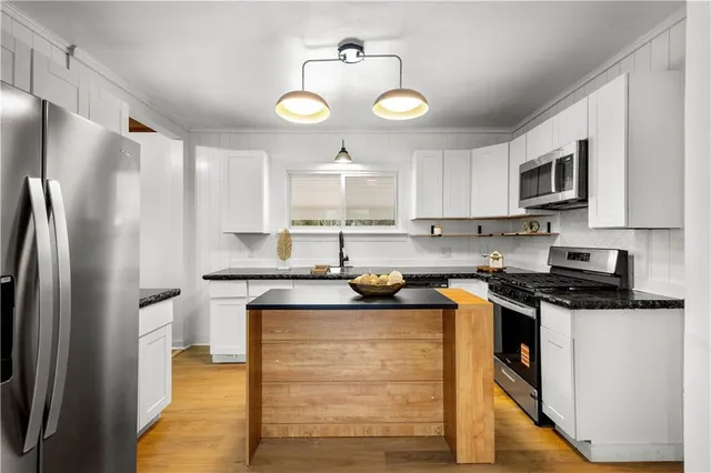 a kitchen with a sink and a window