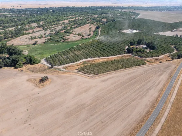 an aerial view of a house with yard
