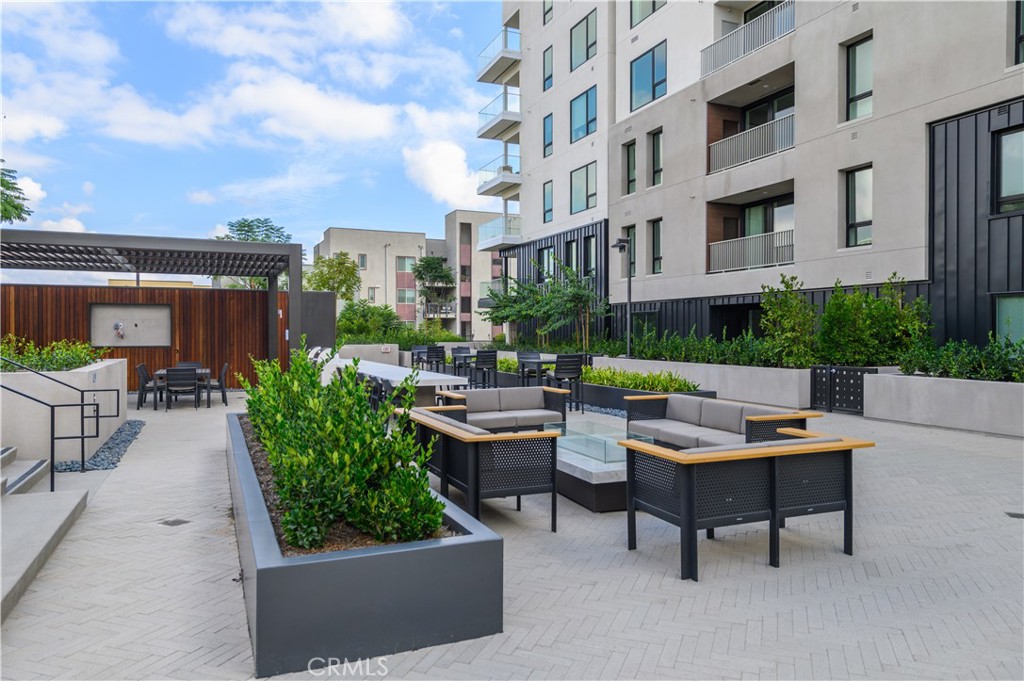 3608 Rivington Irvine, CA 92612 - Photo 58 of 74 a view of a patio with a table and chairs and potted plants