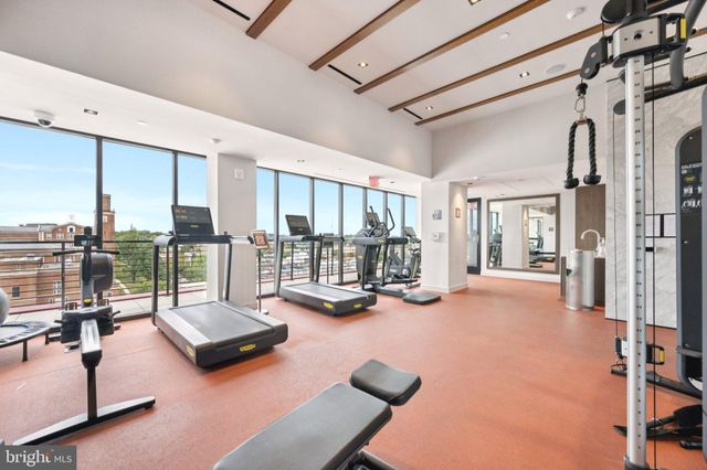 a view of a gym with gym equipment