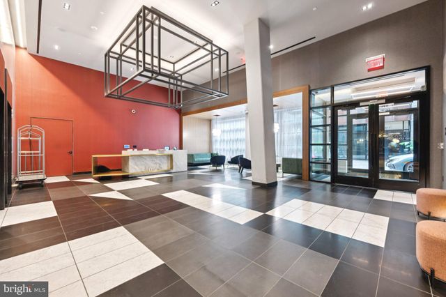a view of a living room and kitchen
