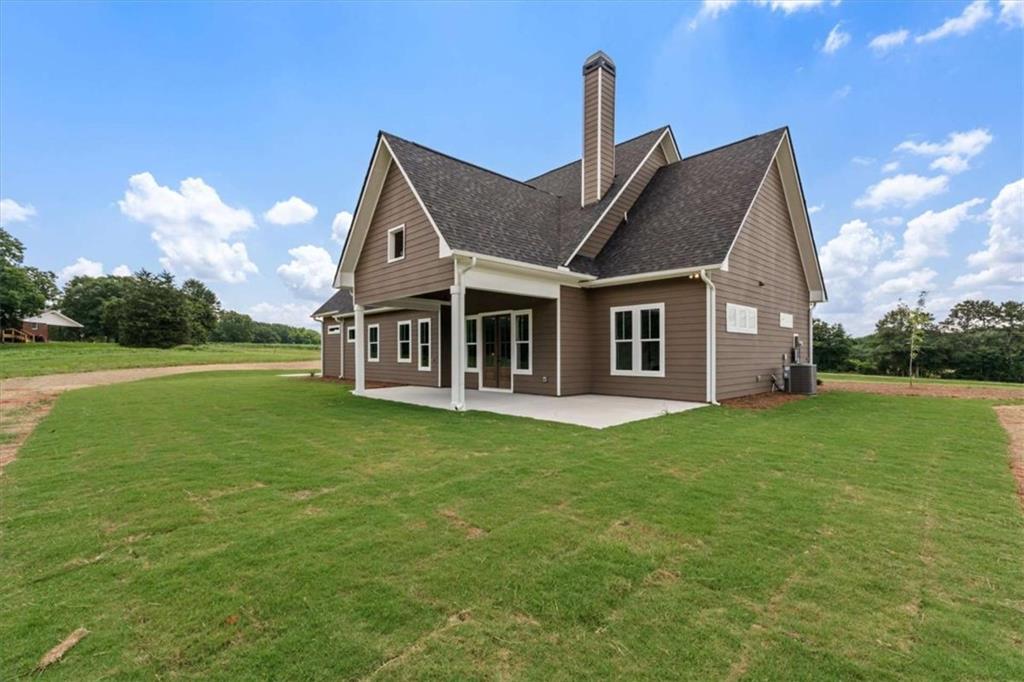 591 Welcome Road Roopville, GA 30170 - Photo 50 of 60 a view of a house with a big yard