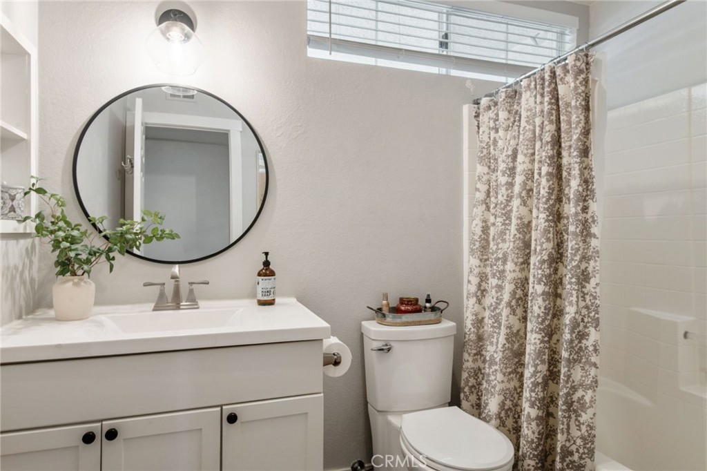 40456 Windsor Road Temecula, CA 92591 - Photo 12 of 38 a bathroom with a sink mirror and toilet