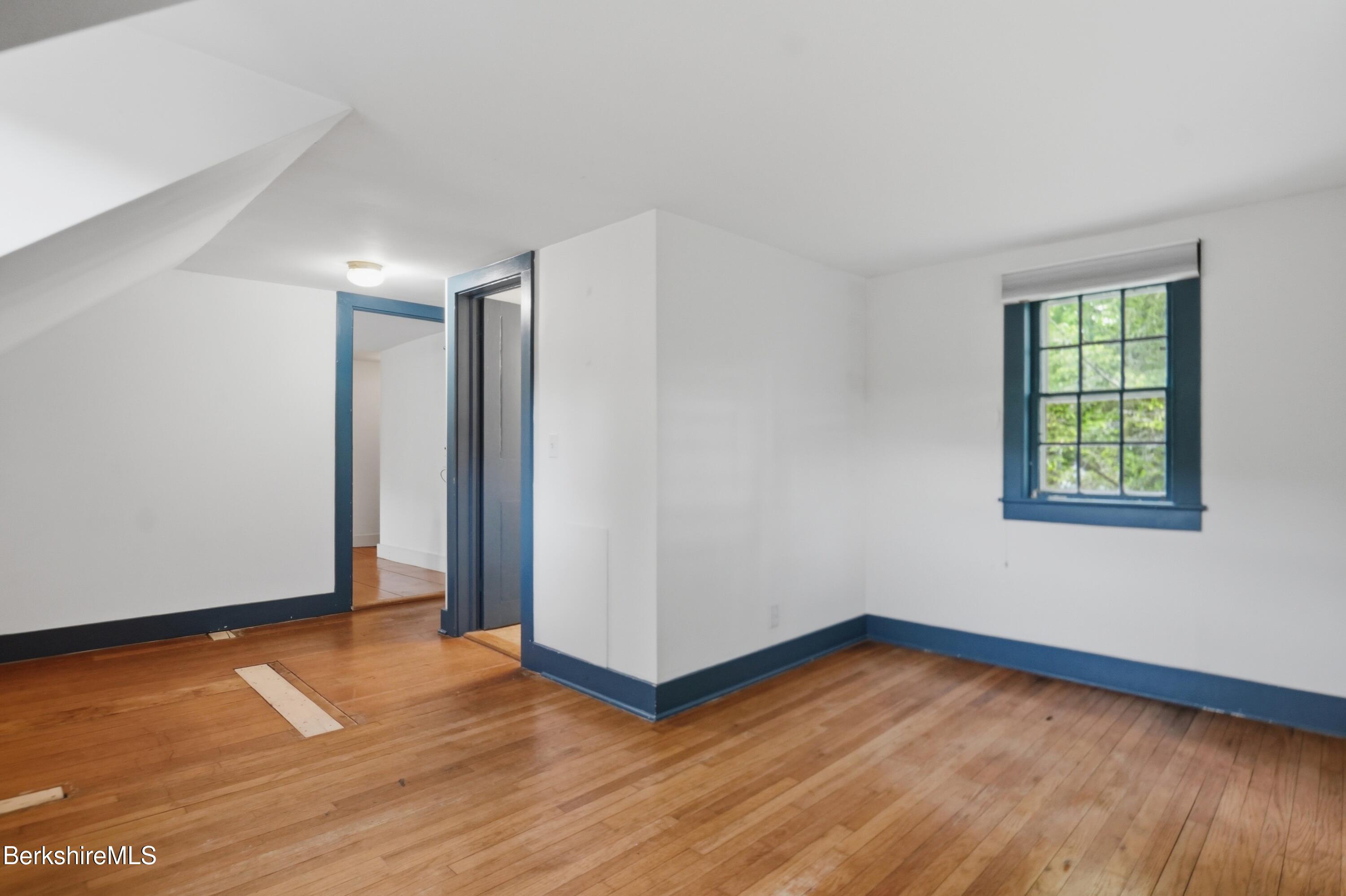 4 Stockbridge Road West Stockbridge, MA 01266 - Photo 54 of 94 an empty room with wooden floor and windows