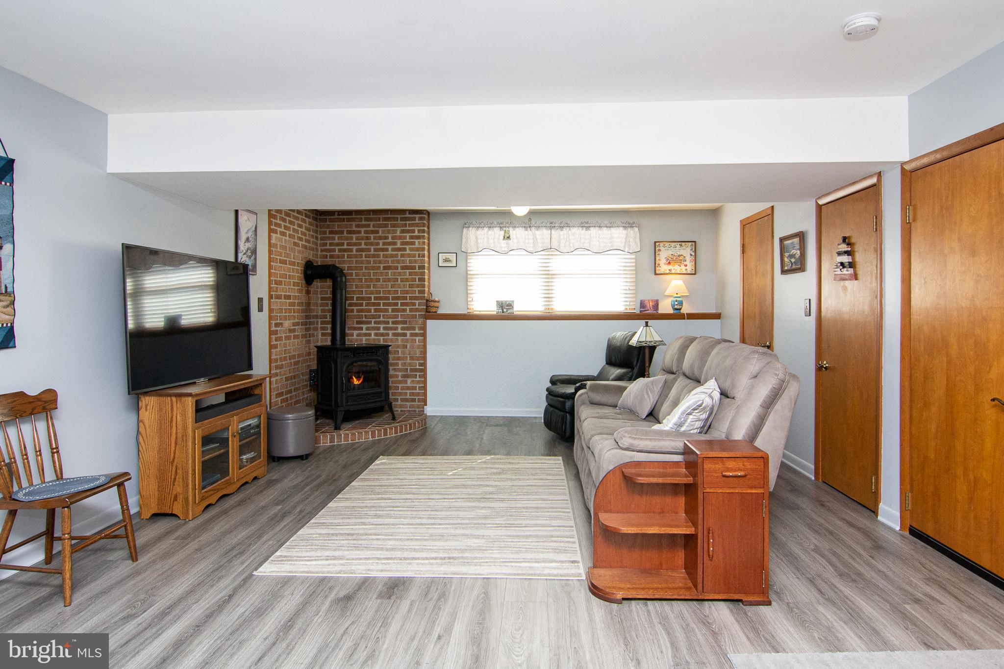 4200 Arthur Shipley Road Westminster, MD 21157 - Photo 27 of 46 a living room with furniture and a flat screen tv