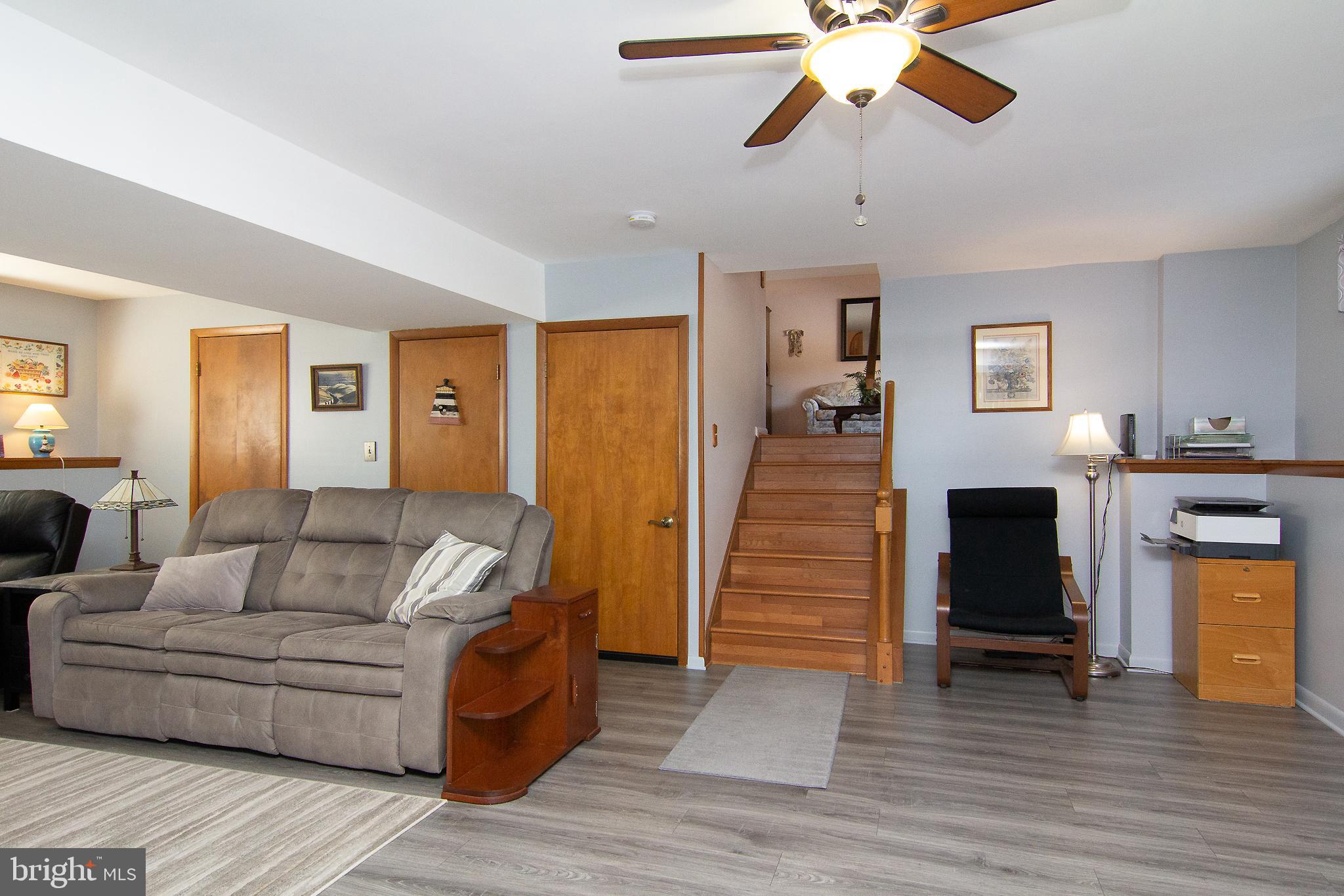 4200 Arthur Shipley Road Westminster, MD 21157 - Photo 29 of 46 a living room with furniture and a fireplace