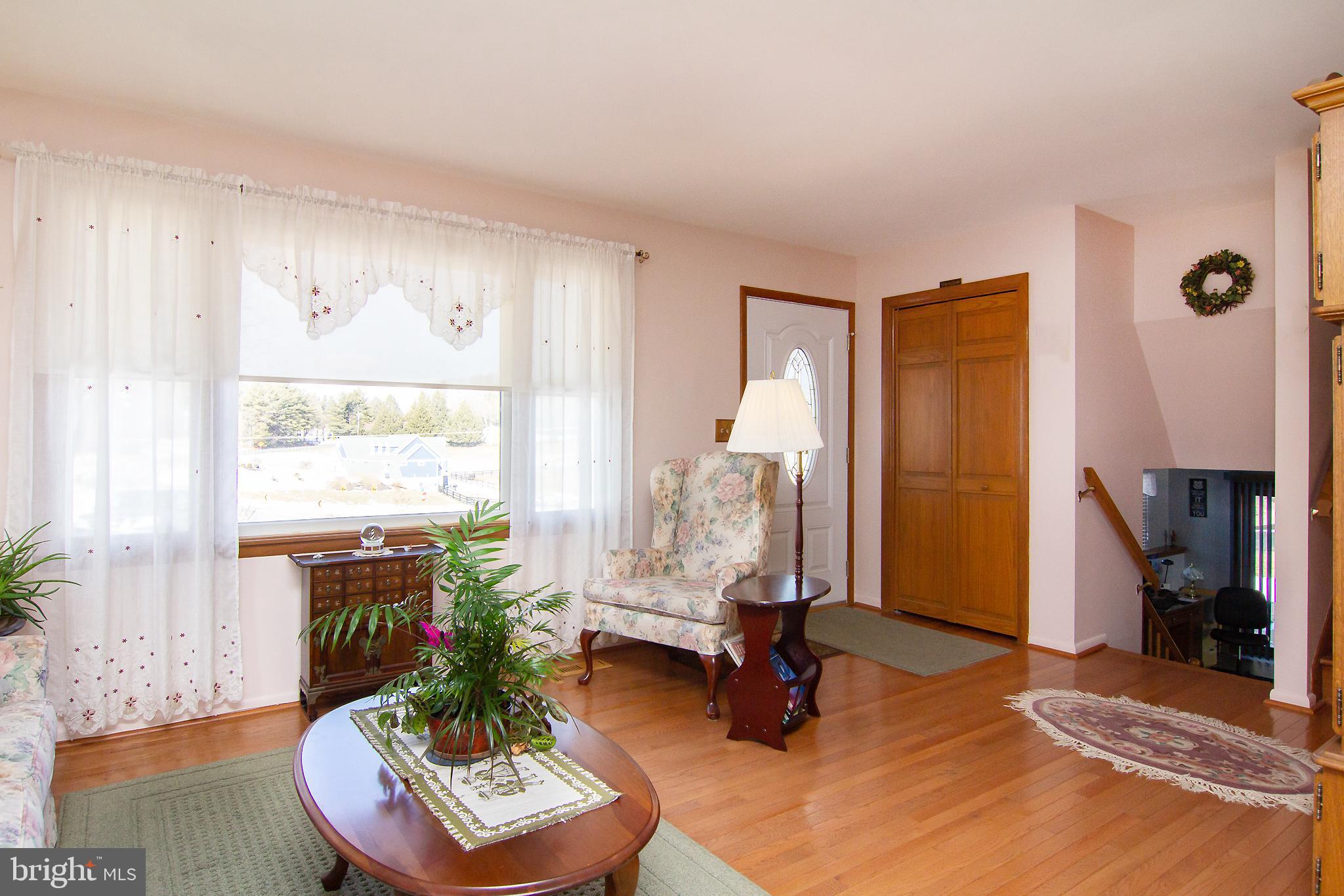 4200 Arthur Shipley Road Westminster, MD 21157 - Photo 6 of 46 a living room with furniture and a floor to ceiling window