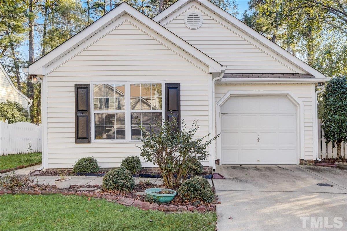 5102 Gable Ridge Drive Durham, NC 27713 - Photo 1 of 17 a view of a white house next to a yard and garage