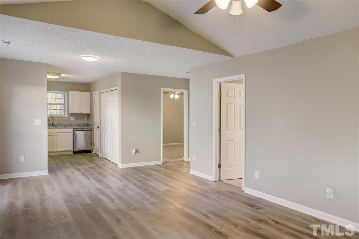 5102 Gable Ridge Drive Durham, NC 27713 - Photo 2 of 17 a view of kitchen with a sink wooden cabinets and window