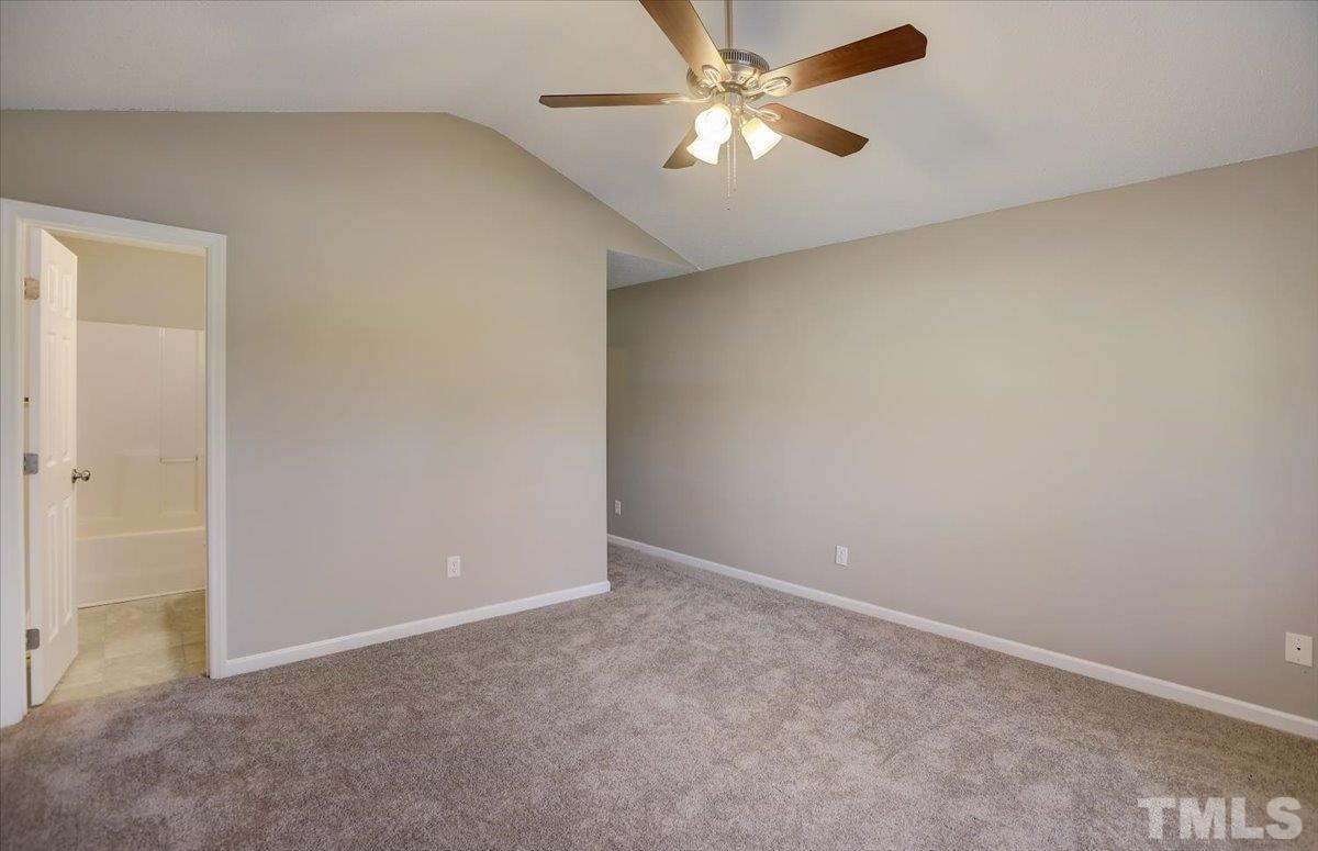 5102 Gable Ridge Drive Durham, NC 27713 - Photo 10 of 17 an empty room with a fan and a fan