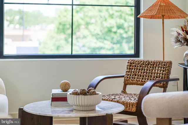 a view of a dining room with furniture window and outside view