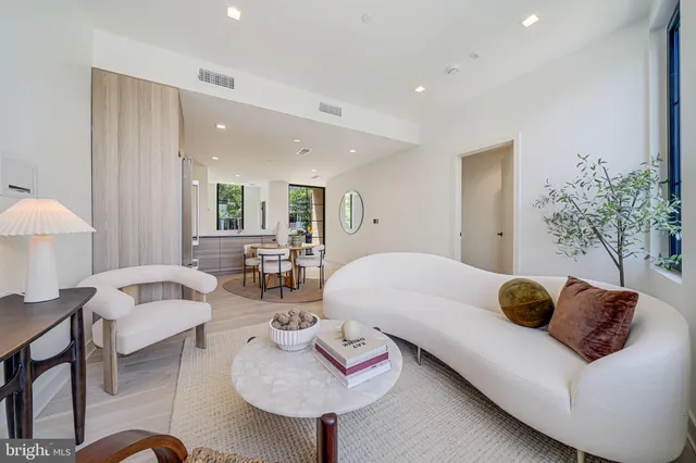 a living room with furniture and a rug