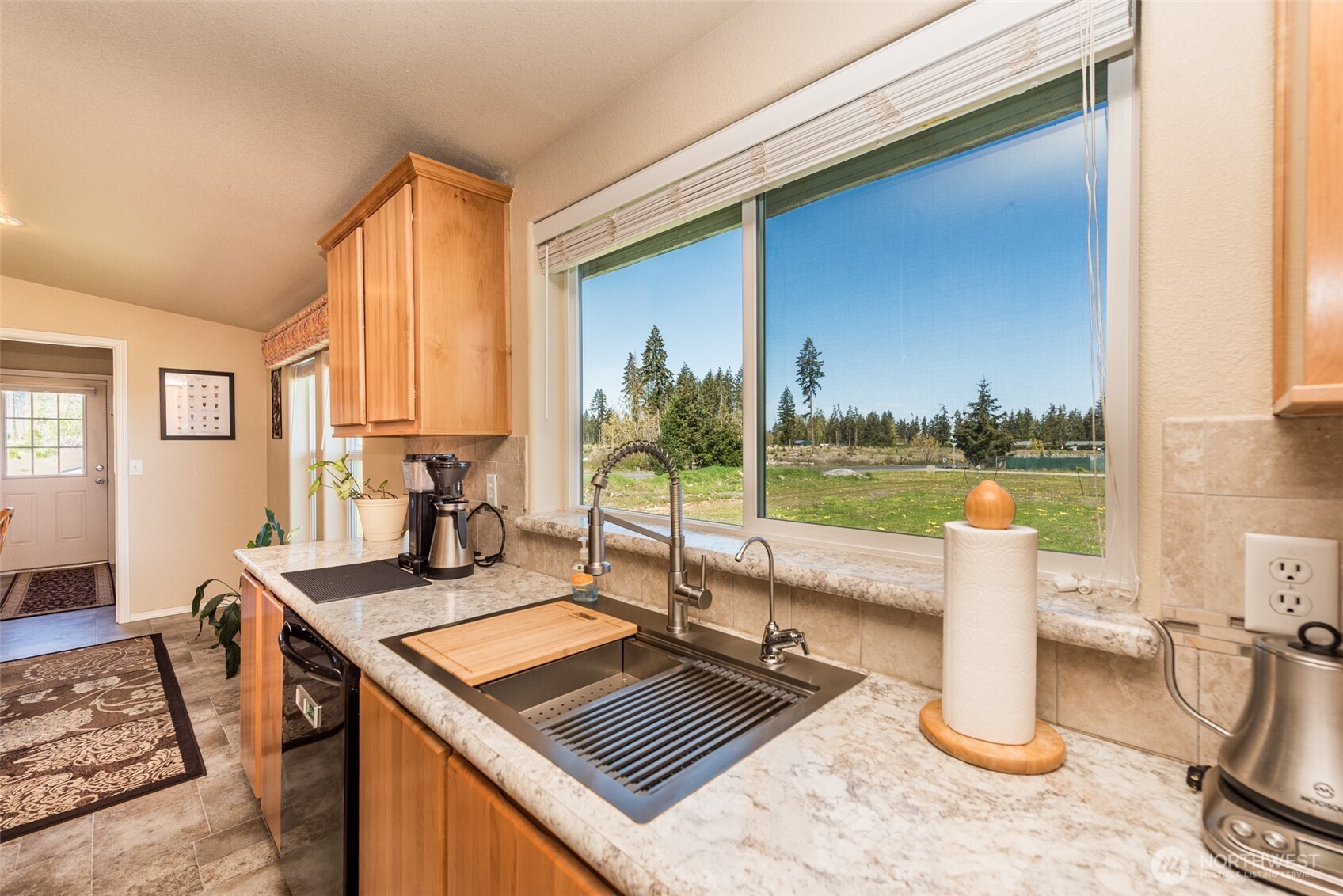 25 Michelle Lane Sequim, WA 98382 - Photo 19 of 38 a view of a living room with a floor to ceiling window and wooden floor