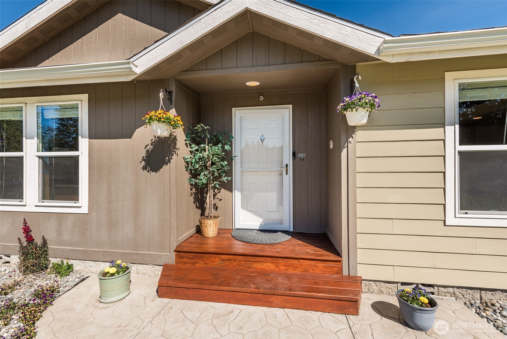25 Michelle Lane Sequim, WA 98382 - Photo 2 of 38 a front view of a house with potted plants