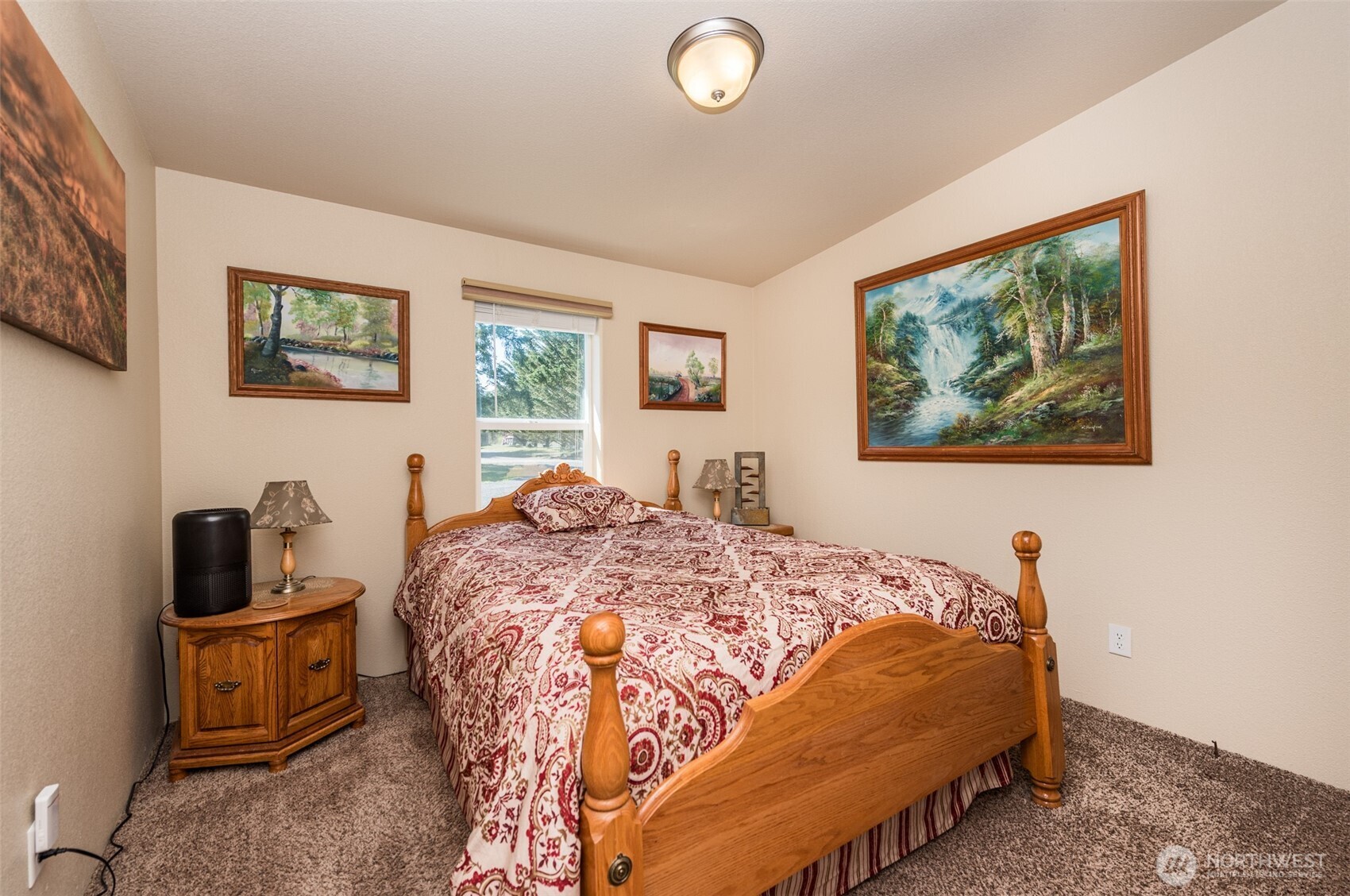 25 Michelle Lane Sequim, WA 98382 - Photo 26 of 38 a bed sitting in a bedroom next to a window