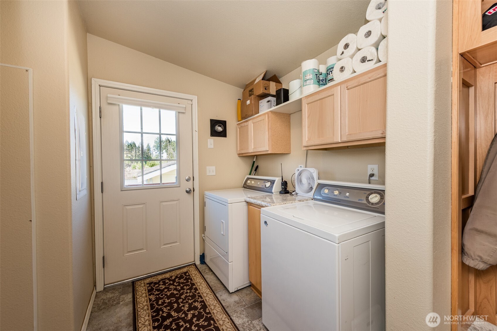 25 Michelle Lane Sequim, WA 98382 - Photo 27 of 38 a kitchen with a sink a stove cabinets and a window