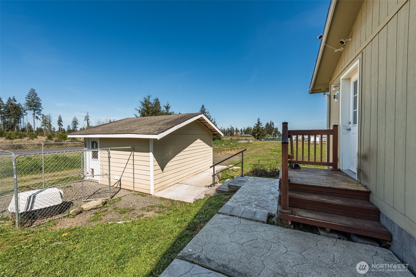 25 Michelle Lane Sequim, WA 98382 - Photo 30 of 38 a view of a house with backyard and porch