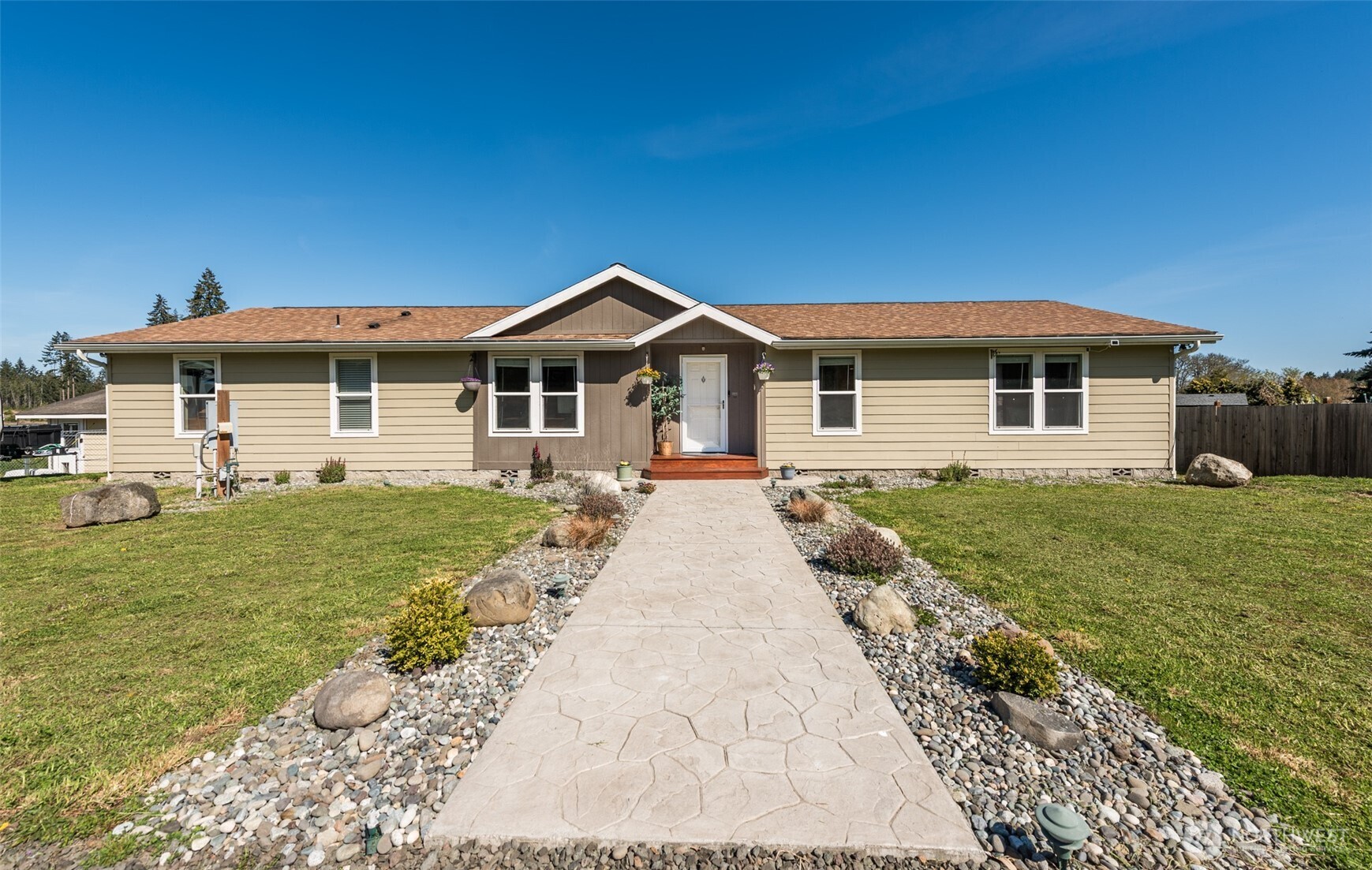 25 Michelle Lane Sequim, WA 98382 - Photo 3 of 38 a front view of a house with a garden