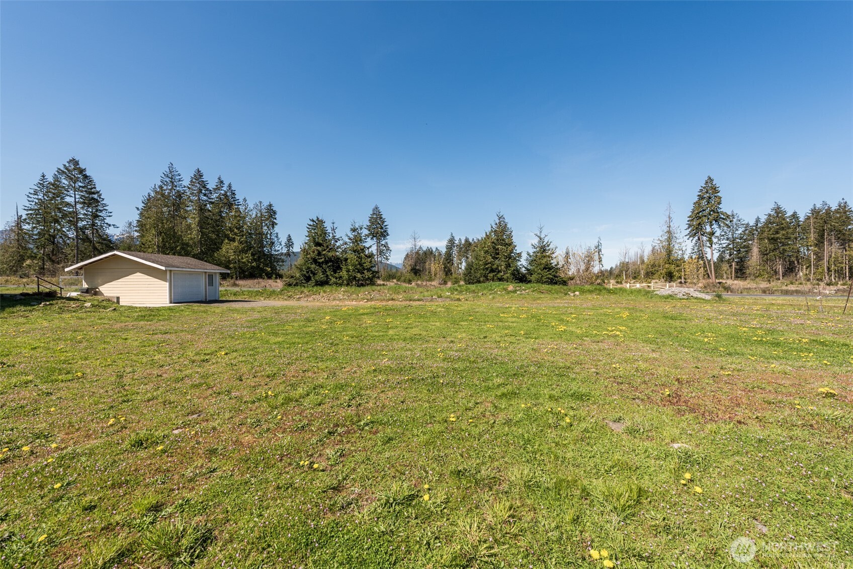 25 Michelle Lane Sequim, WA 98382 - Photo 35 of 38 a large body of water with a large trees all around