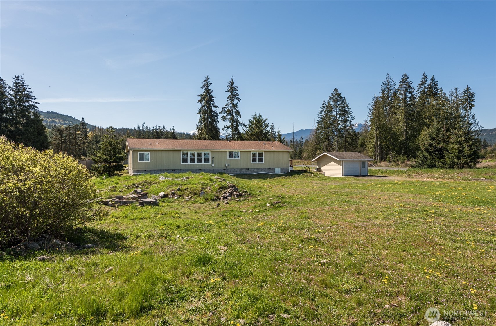 25 Michelle Lane Sequim, WA 98382 - Photo 36 of 38 a view of a fountain in front of the house