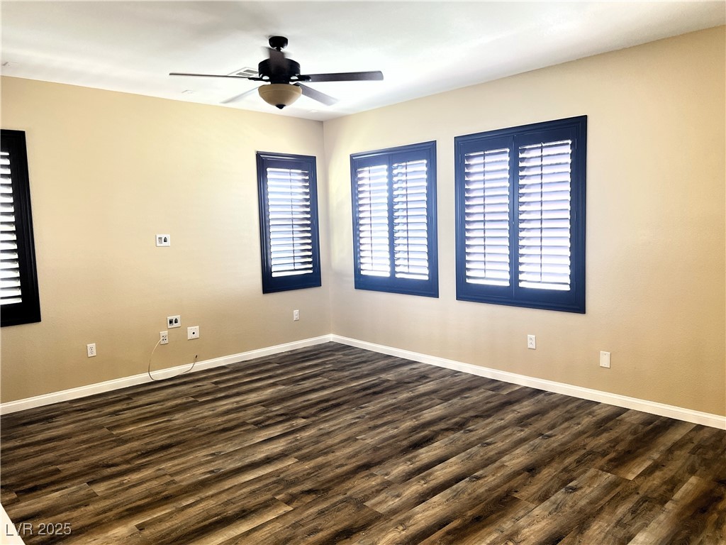 9535 Leaping Lizard Street Las Vegas, NV 89178 - Photo 12 of 37 Second floor living room with wall mount TV hookup, wood like LVP, ceiling fan and shutters