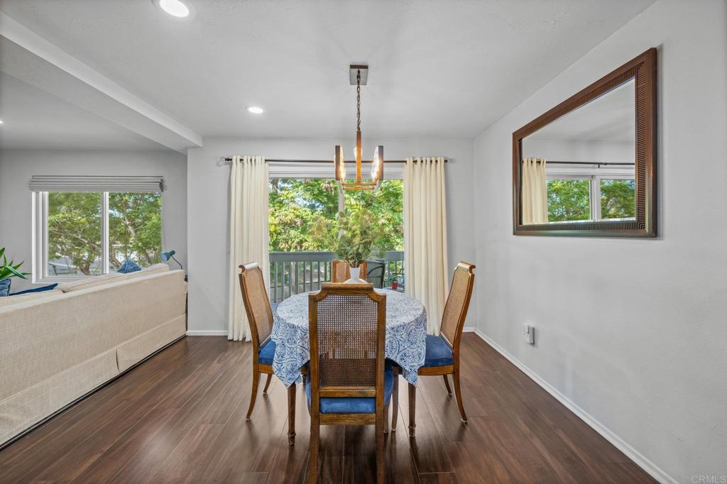 4232 Fiesta Way, Unit 3 Oceanside, CA 92057 - Photo 12 of 33 a view of a dining room with furniture window and wooden floor