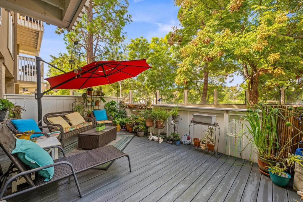 4232 Fiesta Way, Unit 3 Oceanside, CA 92057 - Photo 2 of 33 a view of a chairs and table in the patio with a fire pit