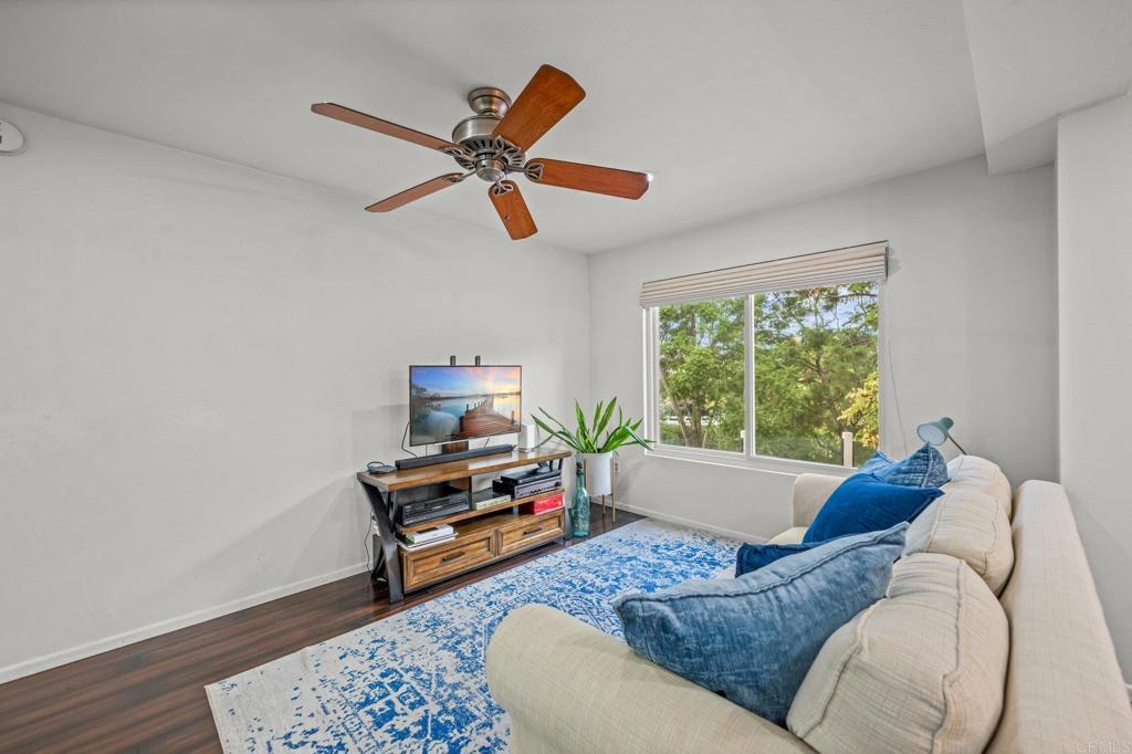 4232 Fiesta Way, Unit 3 Oceanside, CA 92057 - Photo 4 of 33 a living room with furniture and a window