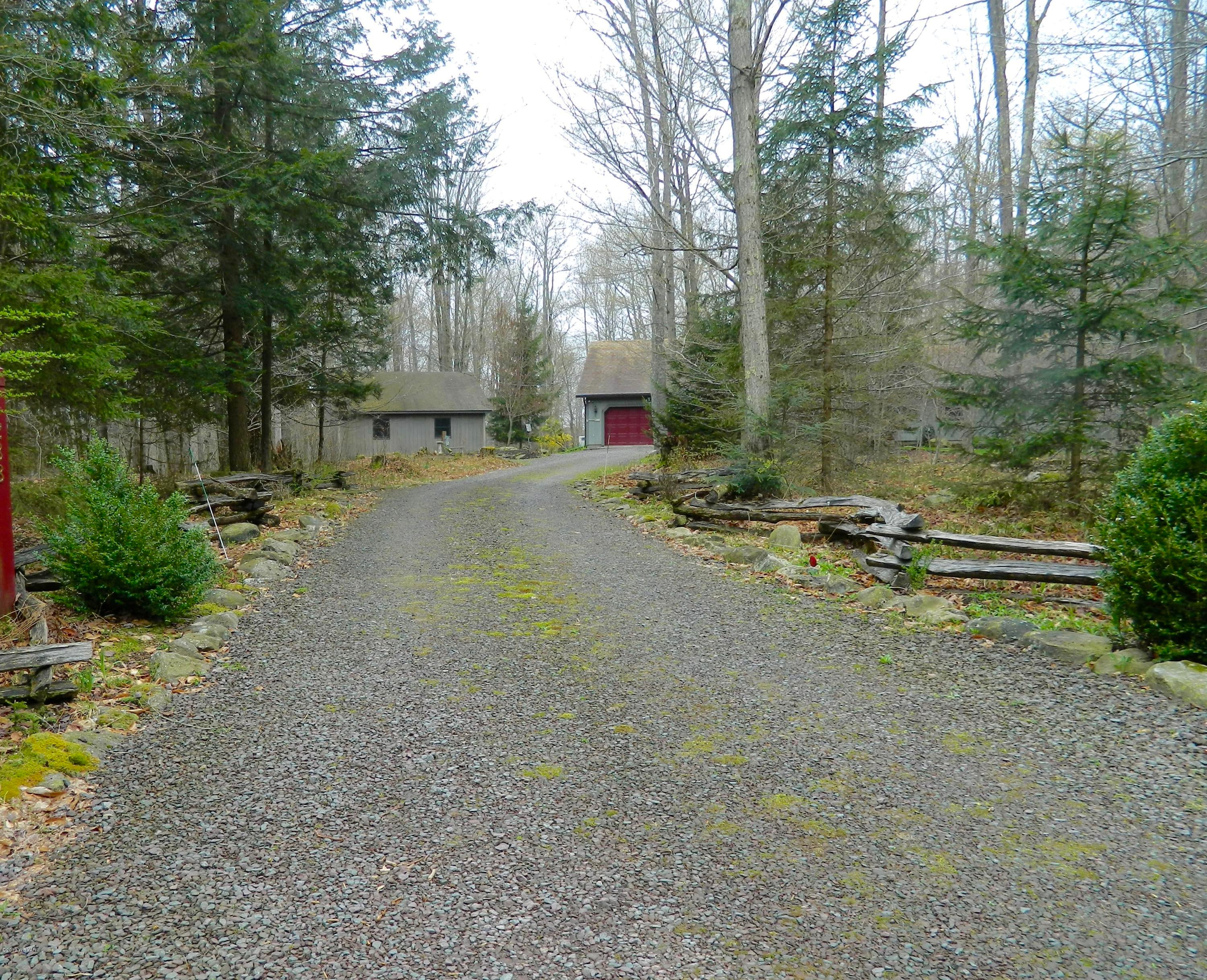 288 Rock Ledge Road Dushore, PA 18614 - Photo 39 of 42 Driveway with Split Rail Fencing