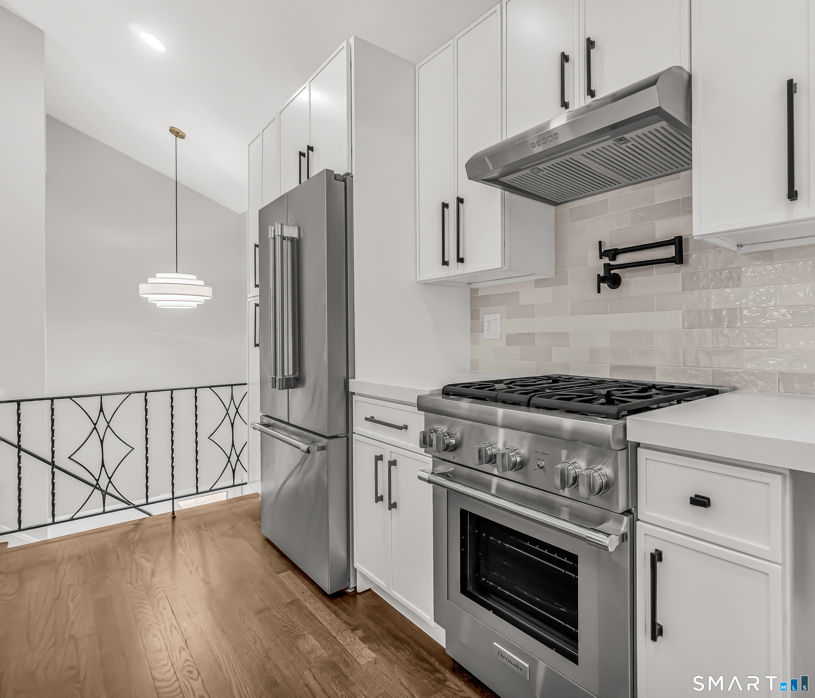 73 Buck Hill Road Easton, CT 06612 - Photo 13 of 44 a kitchen with stainless steel appliances granite countertop a stove a refrigerator and a wooden floor