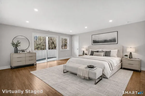 a spacious bedroom with a large bed and a dresser