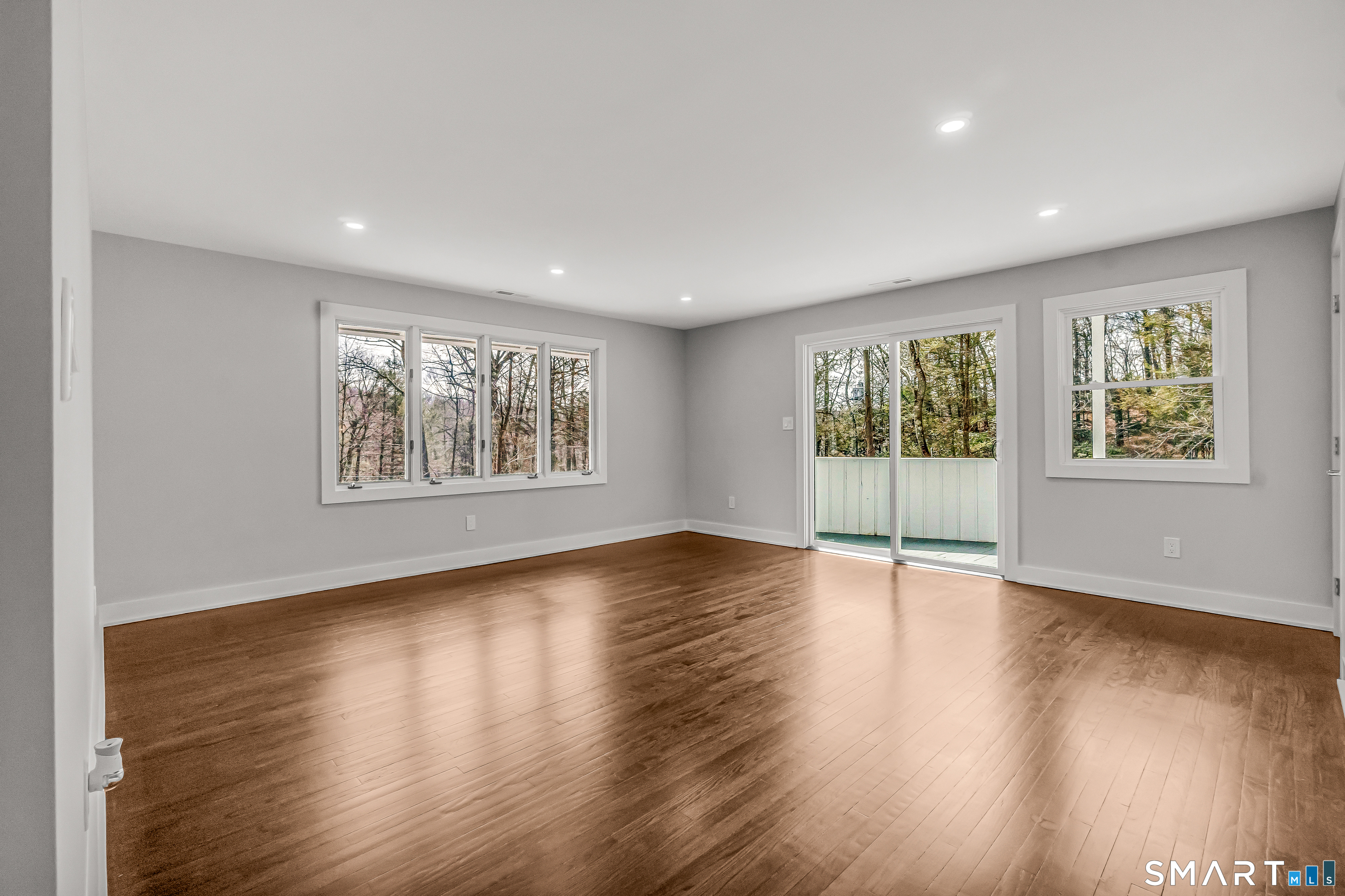 73 Buck Hill Road Easton, CT 06612 - Photo 18 of 44 a view of an empty room with wooden floor and a window