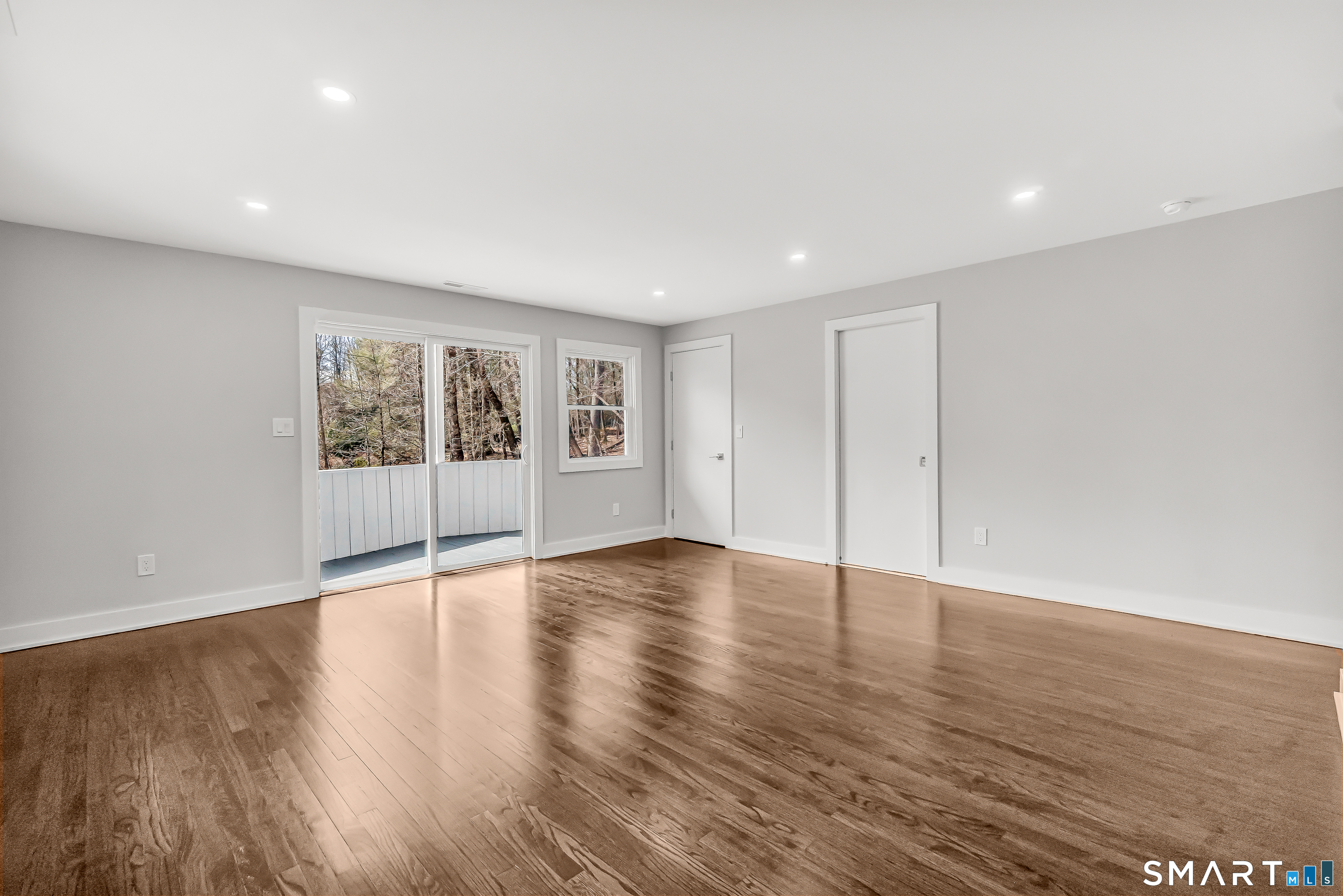 73 Buck Hill Road Easton, CT 06612 - Photo 19 of 44 a view of an empty room with wooden floor and a window