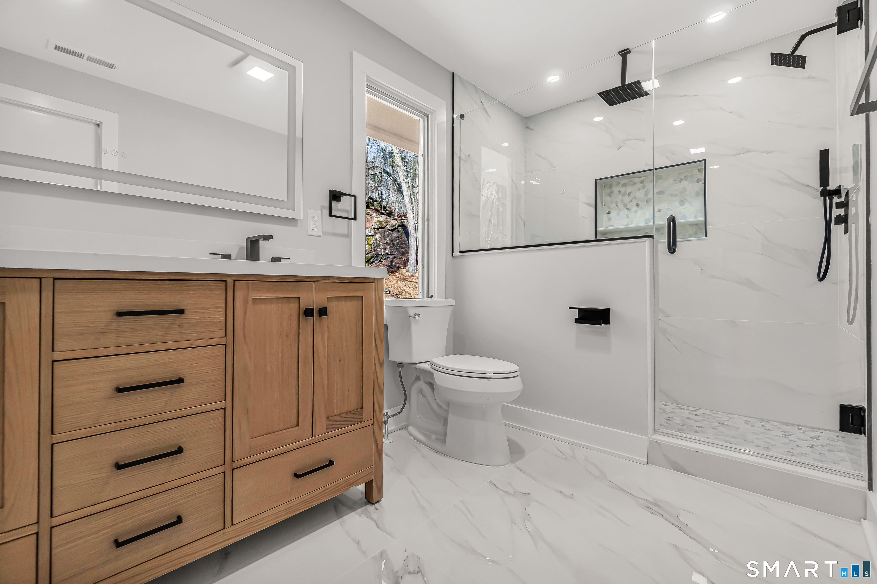 73 Buck Hill Road Easton, CT 06612 - Photo 20 of 44 a bathroom with a toilet sink and shower